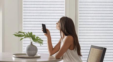 Customize your day and night cycles with motorized window coverings from Hunter Douglas