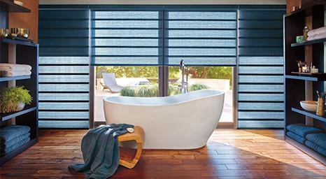 Hunter Douglas shades brings beauty and warmth to any space. Stop by our showroom to experience the full line of Hunter Douglas shades