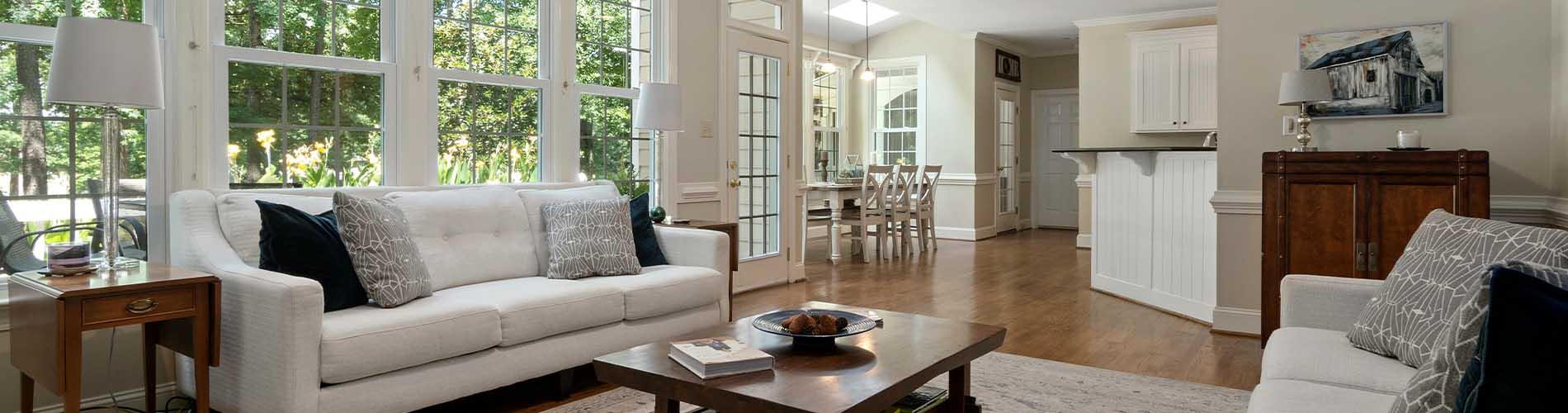 Living room with hardwood floors and grey elegant rug